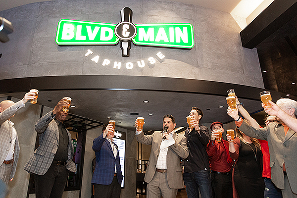 Golden executives raise glasses during inaugural beer toast